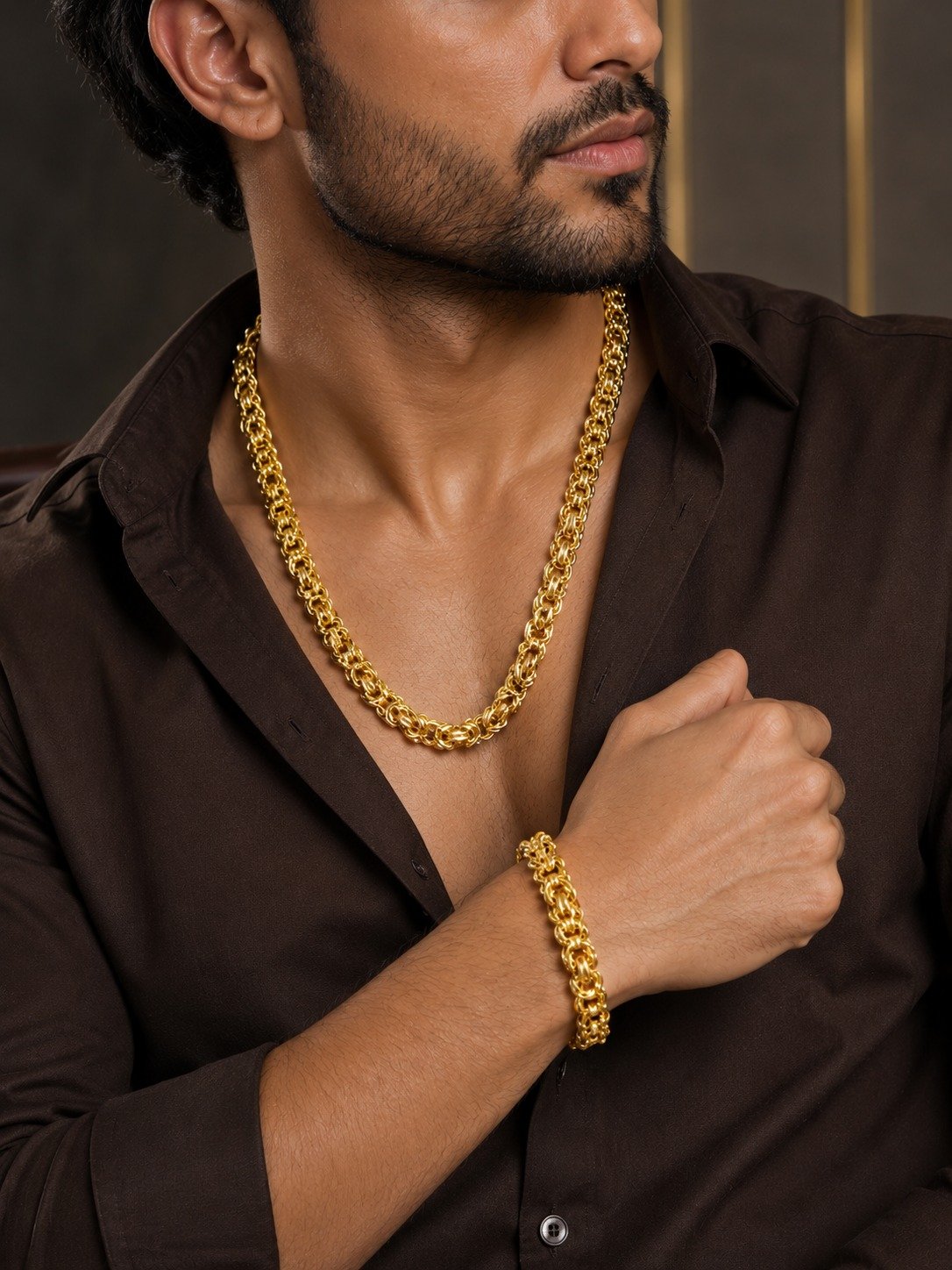 Man wearing the Classic Gold chain and wrist jewellery