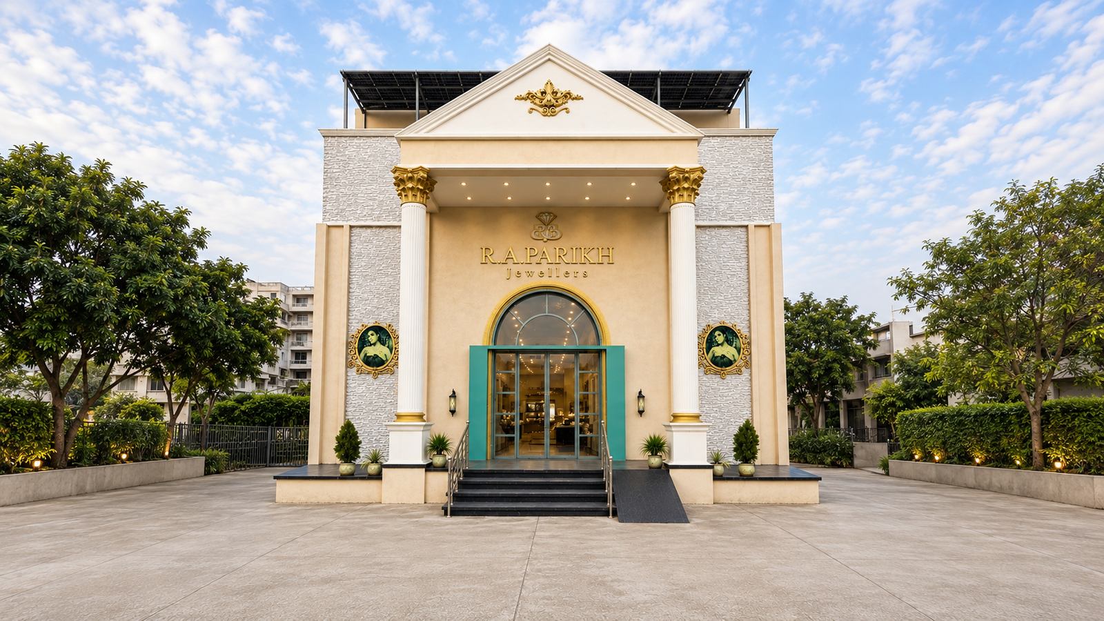 R.A. Parikh Jewellers showroom in Billimora, with gold detailing and a grand columned entrance